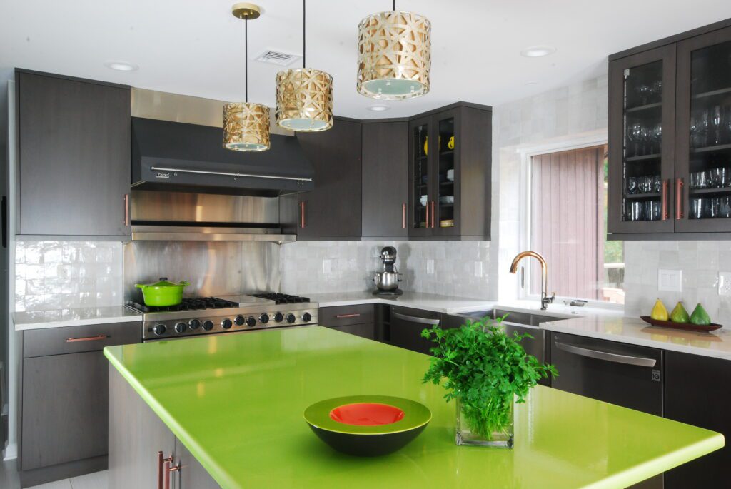 Unique Kitchen remodel by Tobias Design LLC featuring a lime green island countertop with dark cabinetry.